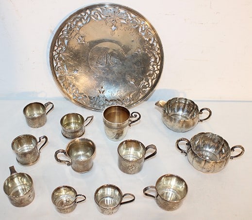 13 Pieces Of Sterling Silver 27 Ozt: 13 pieces of sterling silver 27 ozt including 10" reticulated plate, 10 mugs, and sugars and creamers. Williamstown estate. 27.16 ozt.