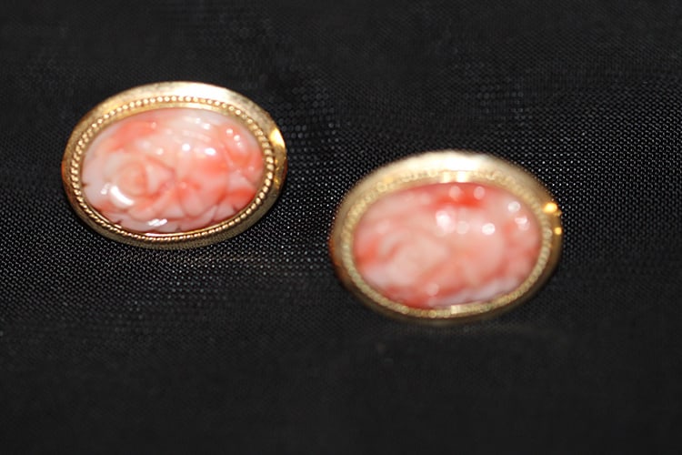 Pair Of 14K And Hand Carved Rose Coral Earrings: Pair of 14k and hand carved rose coral earrings. Rope twist border with Omega backs. Nice condition. Monterey estate.