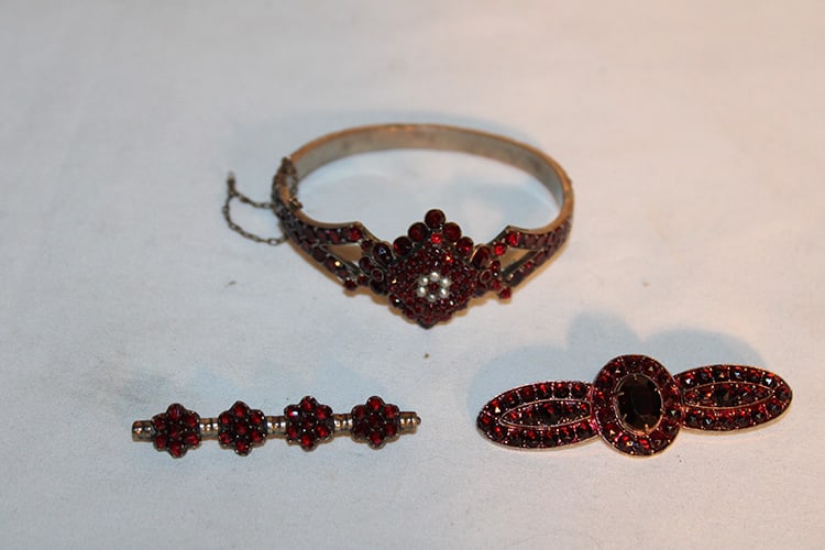 3 Pieces Of Bohemian Garnet Jewelry: 3 pieces of bohemian garnet jewelry including 2 pins and bracelet. All the stones are there, in nice condition. Monterey estate.