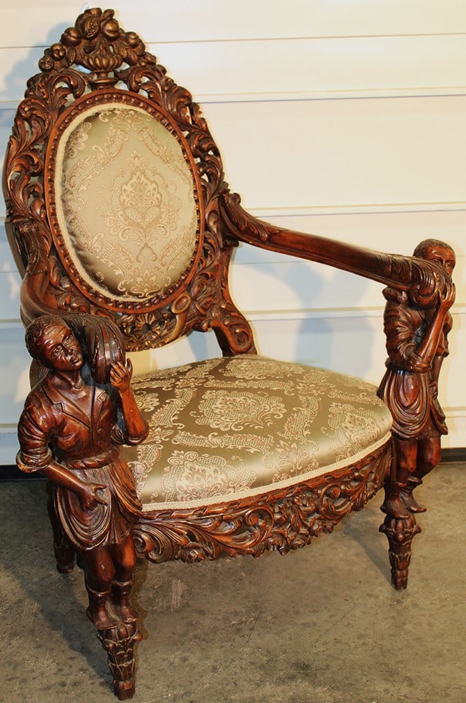 Spectacular 19th Century Hand Carved Kings Chair with Full Body Blackamoors: Spectacular 19th Century Hand Carved Kings Chair with Full Body Blackamoors. Heavily pierced carved back with a urn of fruit and cornucopias, has a nice damask style upholstery. Estate fresh. 35" wide