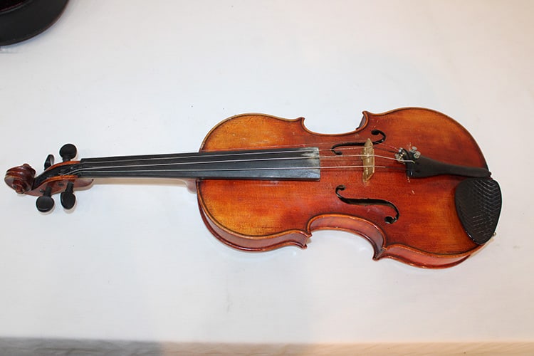 Old 4/4 Violin Labelled John Juzek Formerly in Prague - Made in Germany: Old 4/4 Violin Labelled John Juzek Formerly in Prague - Made in Germany. Tiger maple 2 piece back with a bow and case. Has some name on it (see photo).