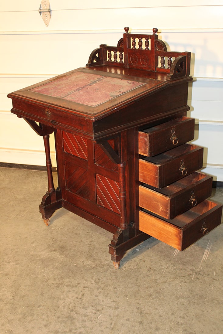 Walnut Victorian Devenport Desk: Walnut Victorian Devenport Desk. Has a lift top and 4 side drawers, with spindle gallery. Is missing a couple of chips of veneer on the lid (see photo), wear consistent with age. 24" wide X 39" tall X