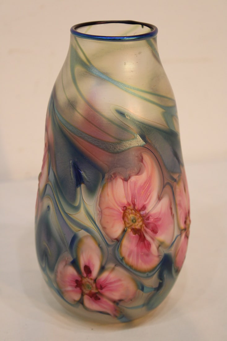 Signed Charles Lotton with a Multi Flora Design: Signed Charles Lotton with a Multi Flora Design. Hand blown, very pretty pink floral design, with blue/green leaf. 1980 in excellent condition. 8" tall.