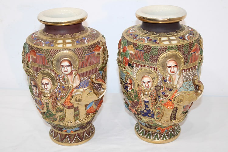 Nice Pait of Signed Antique Japanese Satsuma High Relief Vases: Nice Pait of Signed Antique Japanese Satsuma High Relief Vases. Decorated with elephants, people, etc.. All with nice coloring. 12" tall.