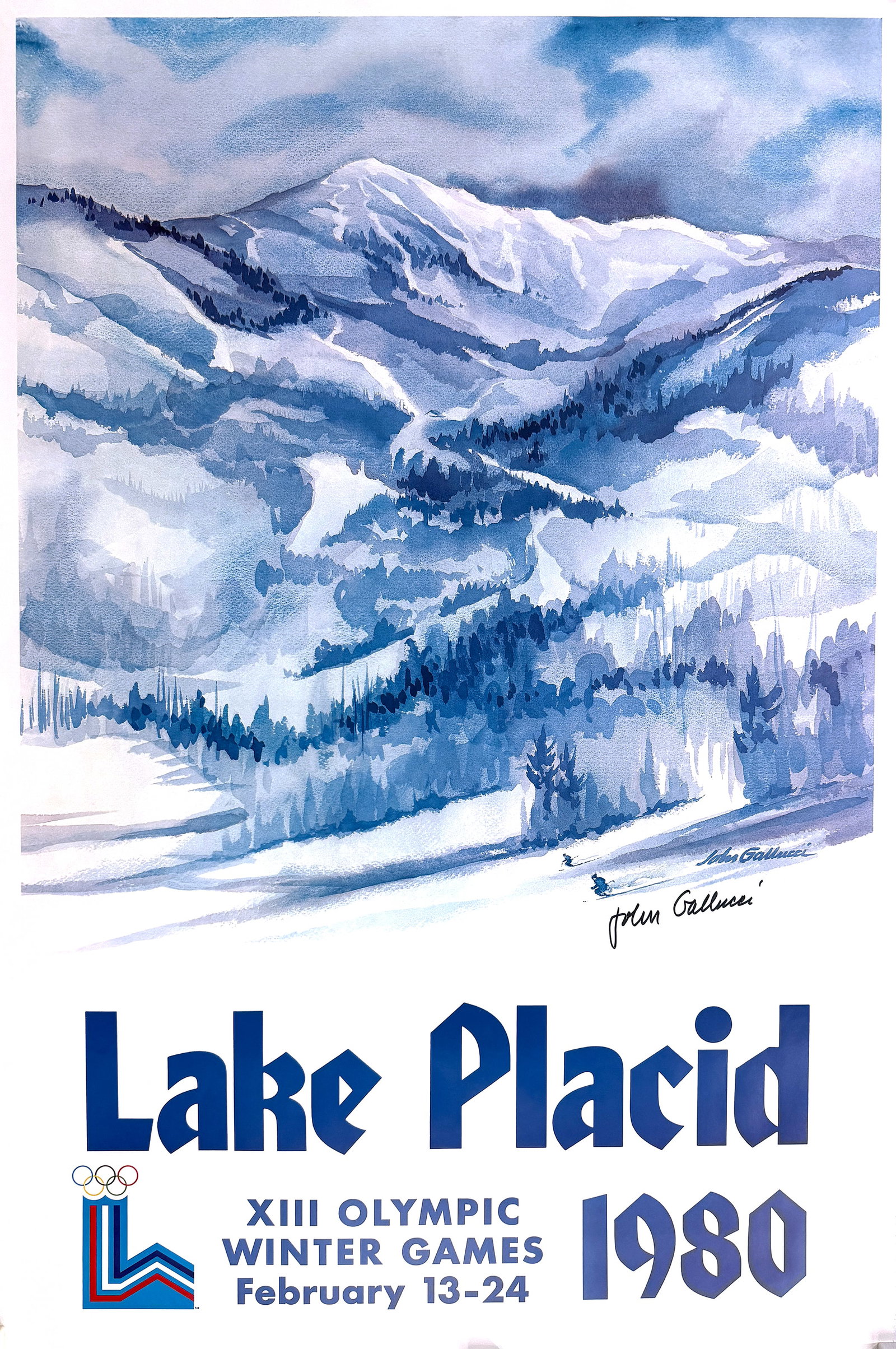 Original Lake Placid Winter Olympics 1980 - Mountain Text lVintage Poster Hand Signed by John: This is an original vintage poster, printed using offset lithographic plates. It was created by the American watercolor artist, John Gallucci (1918 – 2009) in 1979 and was commissioned by the Winter