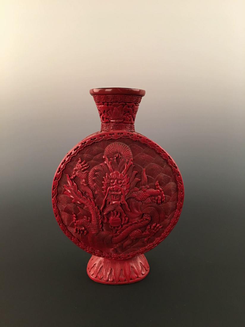 Chinese Carved Lacquerware Dragon Moon Flask Vase With: Chinese Carved Lacquerware Dragon Moon Flask Vase With Qianlong Mark Of Four Characters . 10-1/4'' H, 7'' W; 1.8 lb Shipping: We are able to pack and ship this item to an address in the United States 