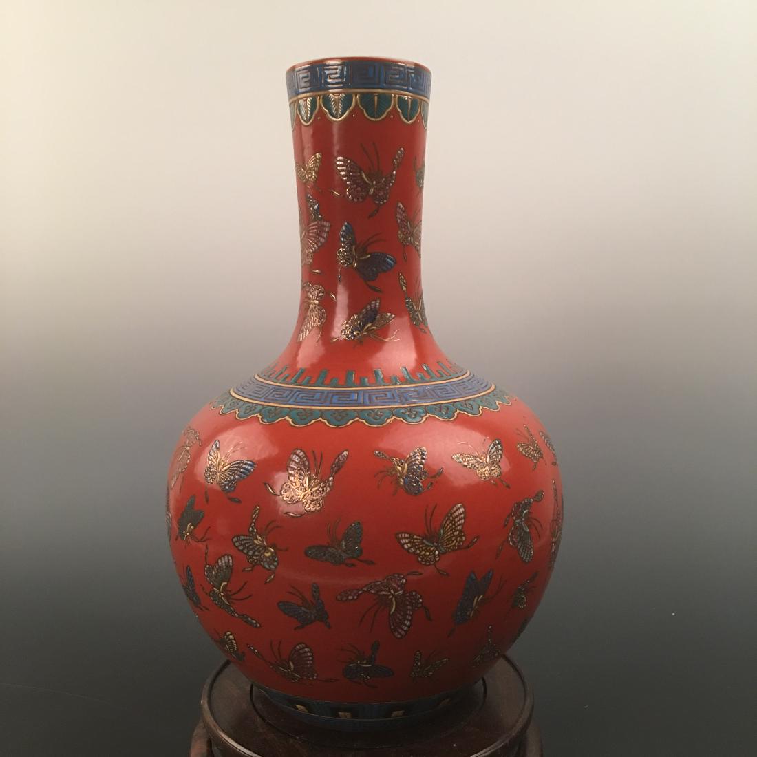 Chinese Famille Rose Of Butterfly Pattern Decorated: Chinese Famille Rose Of Butterfly Pattern Decorated Porcelain Globular Vase With Kangxi's Mark 15-1/2'' H, 10'' W; 7.4 lb Shipping: We are able to pack and ship this item to an address in the United S