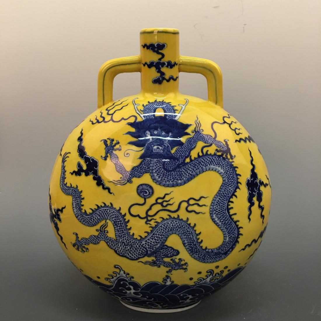 Chinese Blue-White 'Dragon' Moon Flask Vase, Qianlong: Chinese Blue-White '5-Claw Dragon' Moon Flask Vase, Qianlong Mark 13-1/4'' H, 10-1/4'' W; 7.4 lb Shipping: We are able to pack and ship this item to an address in the United States for $35.00 via UPS 
