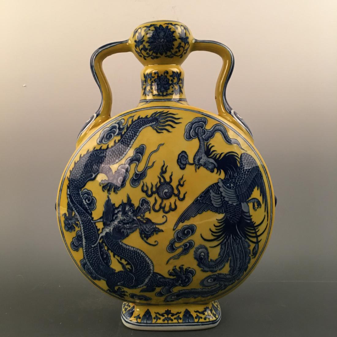 Chinese Blue-White Yellow Glazed 'Dragon' Moon Flask: Chinese Blue-White Yellow Glazed 'Dragon' Moon Flask Vase, Qianlong Mark 13'' H; 9-1/2'' W; 7 lb Shipping: We are able to pack and ship this item to an address in the United States via UPS Ground or U
