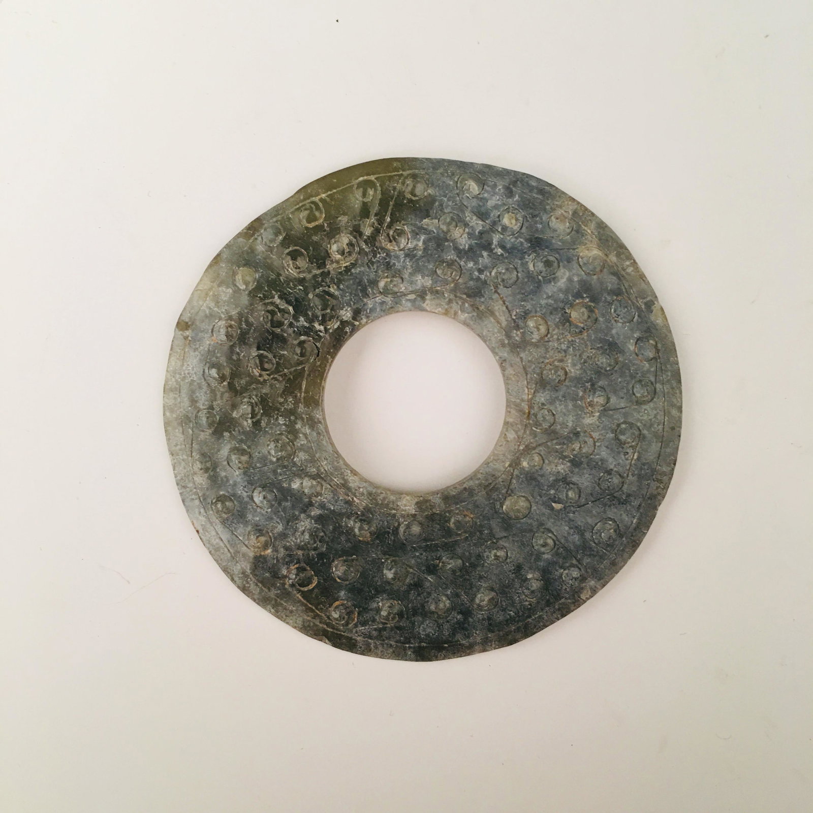 Chinese Jade Bi: Chinese Jade Bi D. 2-1/2''; 24 g Shipping: We are able to pack and ship this item to an address in the United States for $20.00 via UPS Ground or USPS Priority Mail. Tracking information will be sent 