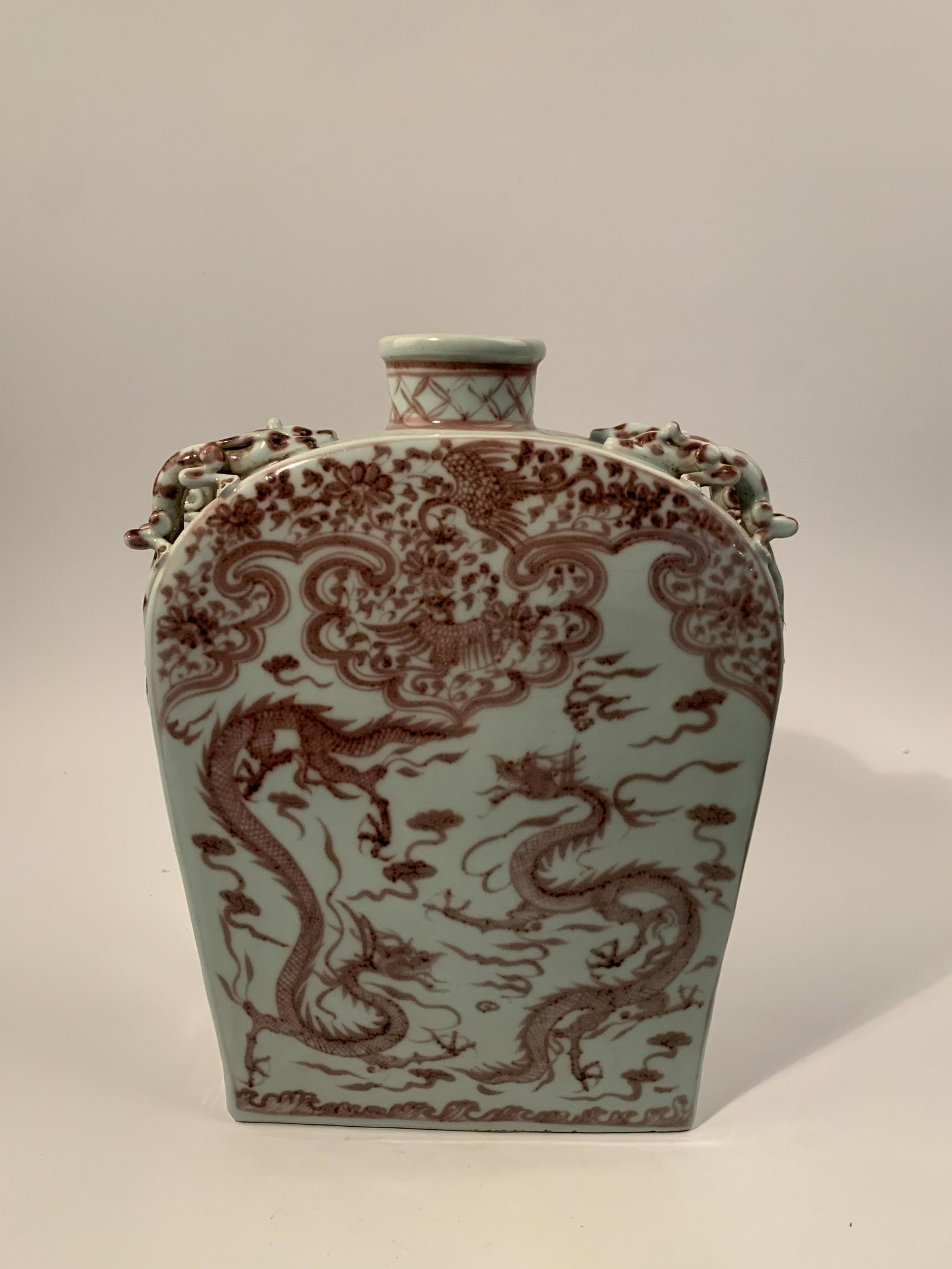 Chinese Yuan Red Glaze Phoenix and Dragon Vase: Chinese Yuan Red Glaze Phoenix and Dragon Vase 16'' H 12'' W 14.6 lb Shipping: We are able to pack and ship this item to an address in the United States via UPS Ground or USPS Priority Mail for $35.23