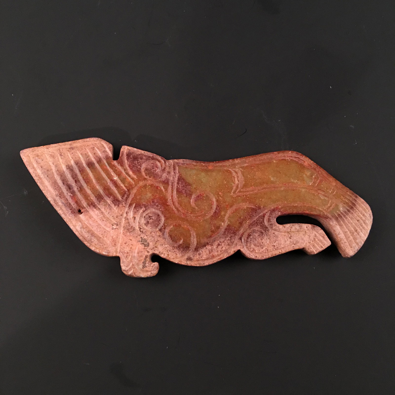 Chinese Archaic Carved Jade Pendant: Chinese Archaic Carved Jade Pendant 1-1/2'' H, 4'' W; 45 g Shipping: We are able to pack and ship this item to an address in the United States for $20.00 via UPS Ground or USPS Priority Mail. Tracking