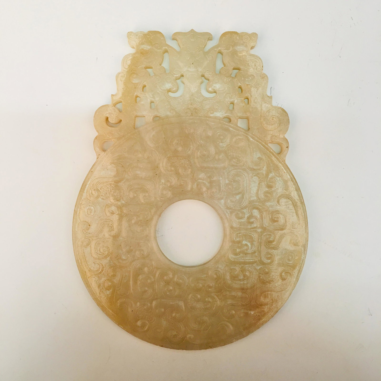 Chinese Jade Bi: Chinese Jade Bi 6-1/8'' H, 4-1/2'' W; 0.4 lb We are able to pack and ship this item to an address in the United States for $35.00 via UPS Ground or USPS Priority Mail. Tracking information will be sen