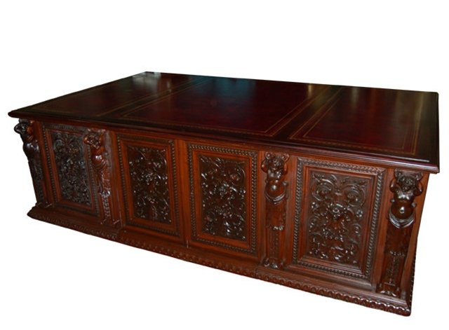 699 Massive Figural Carved Executive Desk: Height: 30 in. (76.20 cm) Width: 95 in. (241.30 cm) Depth: 60 in. (152.40 cm) Country of Origin: European Style: Figural Carved Condition: Restored Year: c. 1880 Description: Massive figural carved ex