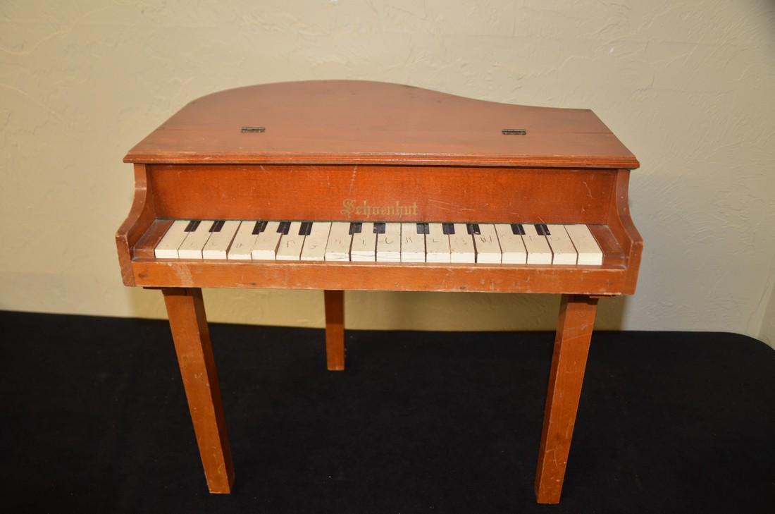 Schoenhut childs piano: This childs piano is in poor condition has markings on each key and only a few keys on the piano still work.