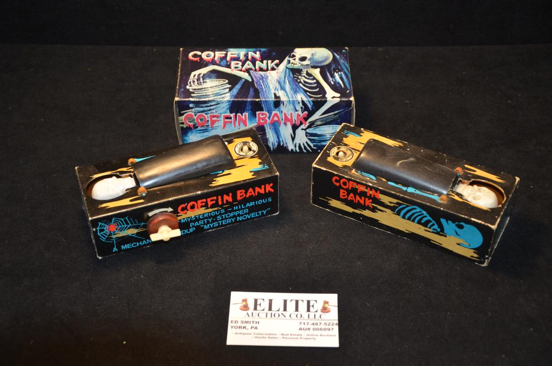 Coffin banks: This lot includes two coffin banks. One bank has been opened and used. The other bank has been well kept with the original box. Both for one money.