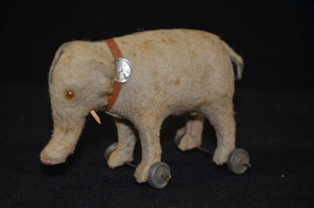 Antique Germany Pull Toy - Elephant: Up for auction is a antique German pull toy Elephant in good condition. This toy is complete and has both tusks still intact. The collar stamp is marked Germany.