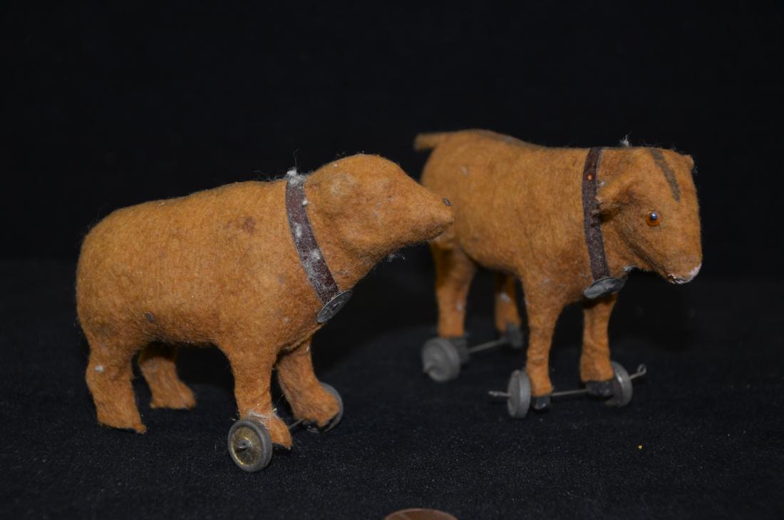 Antique German Pull toys Cow/bear: Up for auction is a lot of 2 Antique German Pull toys both marked Germany. The Bear is missing the back set of wheels and one eye. The cow has all four wheels but the back set is slightly crooked. Bot