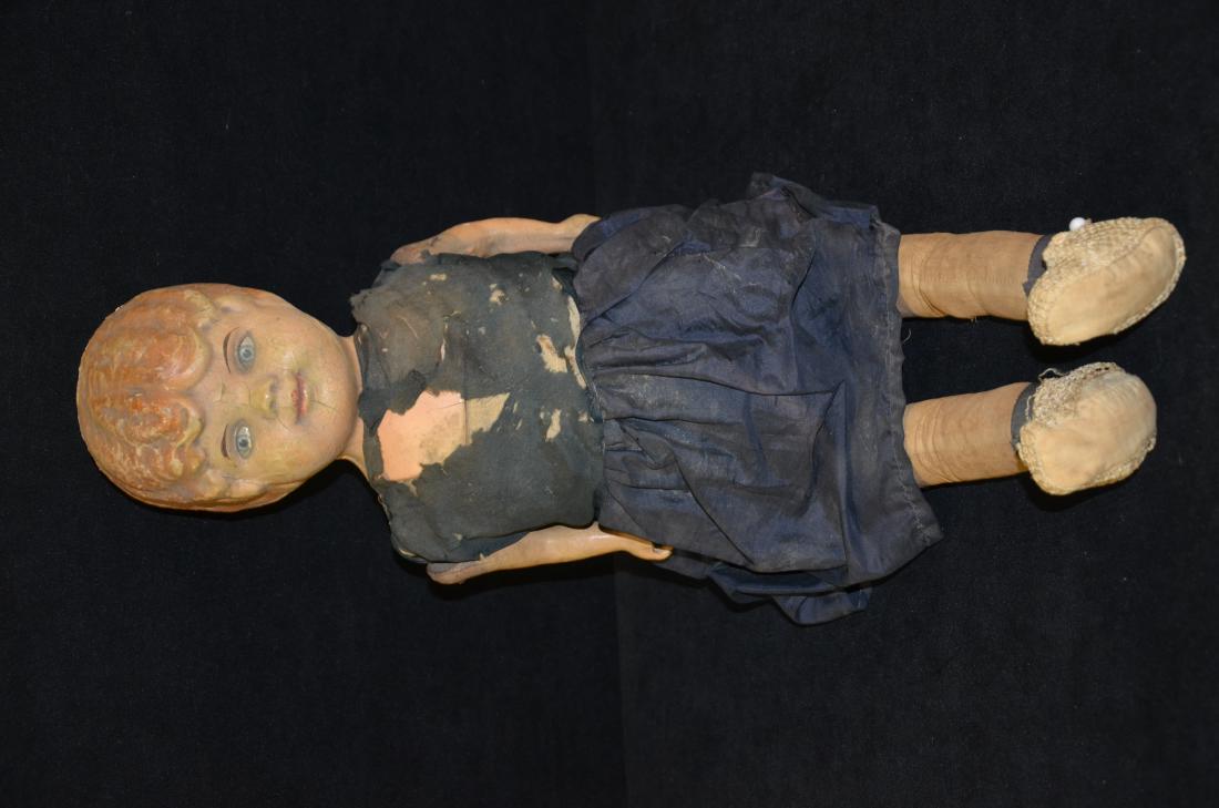 Antique Doll: Up for auction is an antique doll. The face is hand painted and is still intact. There is some small chipping due to age and the material is beginning to come off of the outfit.