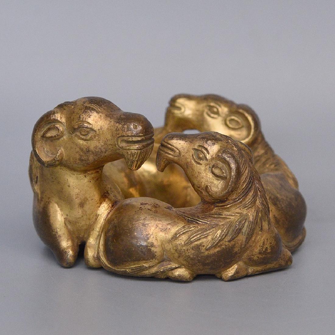 A GILT-BRONZE PAPER WEIGHT (1 of 6)