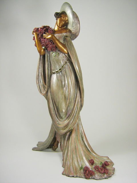 LOUIS ICART "TOSCA" SCULPTURE: Louis Icart Female Figural Sculpture of metal "Tosca", based upon the 1928 etching depicts Floria Tosca from Puccini's opera by the same name is posed holding large bouquet of flowers which symbolizes