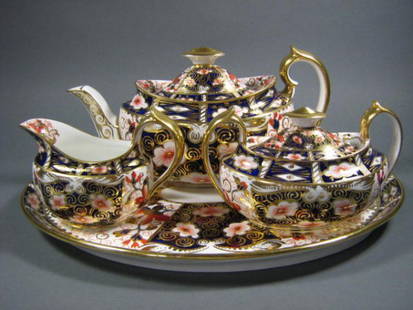 Royal Crown Derby Imari Teaset: Fine Royal Crown Derby "Imari" pattern porcelain teaset. Includes 12" oval serving tray, teapot, milk jug and covered sugar bowl. Good condition. Please note: There are chips on the inside lip of the