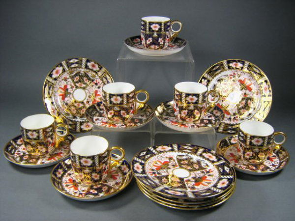 Royal Crown Derby Imari Coffee Cups Saucers: Fine Royal Crown Derby "Imari" pattern china includes 6 x coffee cups (2 1/2"h), 6 x 5" saucers (2 with chips to rim) and 6 x 6" dessert plates.Overall good condition. Various year marks. 18 pieces to