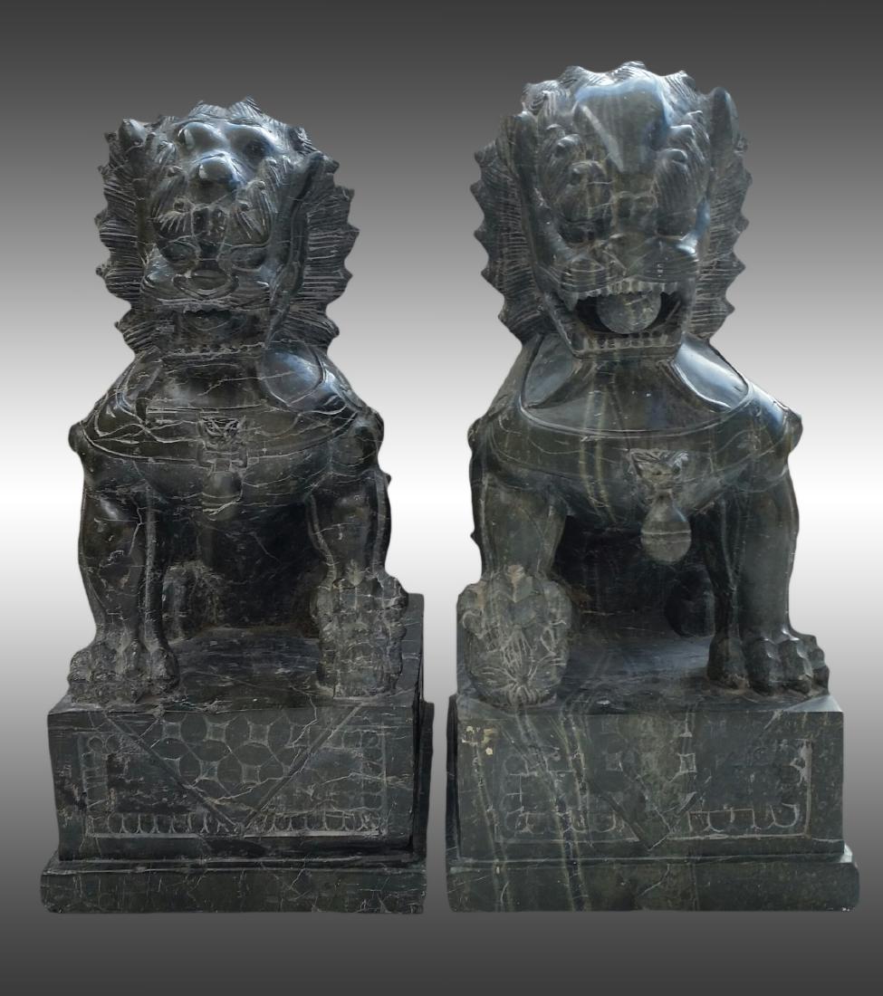 2 FOO DOGS ASIAN SCULPTURES STONE SIGNED BY THE ARTIST.: Pair of Asian Sculpture Foo Dogs. Inscription or signatures in Chinese. Carved in High Quality stone (green marble, or granite or some similar). Hand Made Pieces. Piece #1 Dimensions: 20 in. x 10 in. 
