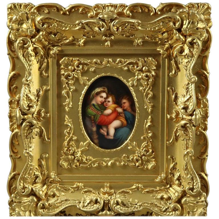 German KPM School Porcelain Plaque after Raphael: An antique German KPM School hand painted polychrome old master porcelain plaque of Madonna Della Sedia after Raphael depicts The Madonna Mother Mary and Christ Child attended by Saint John, seated in