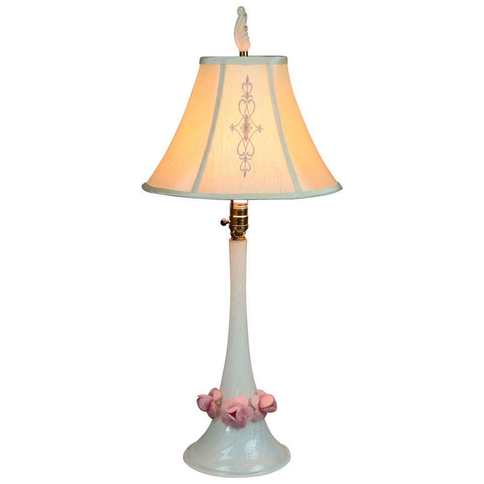 Mid-Century Modern Italian Floral Murano Glass Lamp: A Mid-Century Modern Italian table lamp offers Murano glass base in flared and twisted form with applied flowers, circa 1960. Measures: 33" height x 14.5" diameter shade, 8.5" diameter base. ***IN-HOU