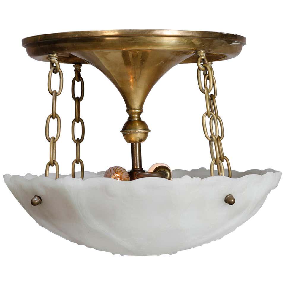 Antique Neoclassical Brass & Molded Frosted Glass Light: An antique neoclassical hanging dome light offers brass dual socket flush mount frame having inverted conical form with central drop column and link chains suspending molded frosted glass shade with A
