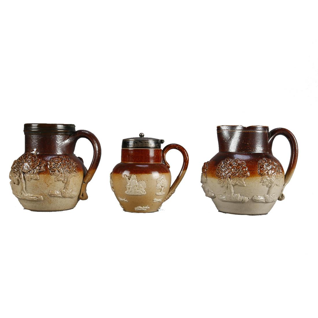 3 Mini Antique Royal Doulton Lambeth Stoneware Vessels: 3 Miniature Antique Royal Doulton Lambeth Stoneware Vessels offer pictorial genre and hunt scenes, 19th century. Measures - pitchers: 3.5" h x 3.75" w, covered: 3" h x 3.25" w. ***IN-HOUSE SHIPPING & 