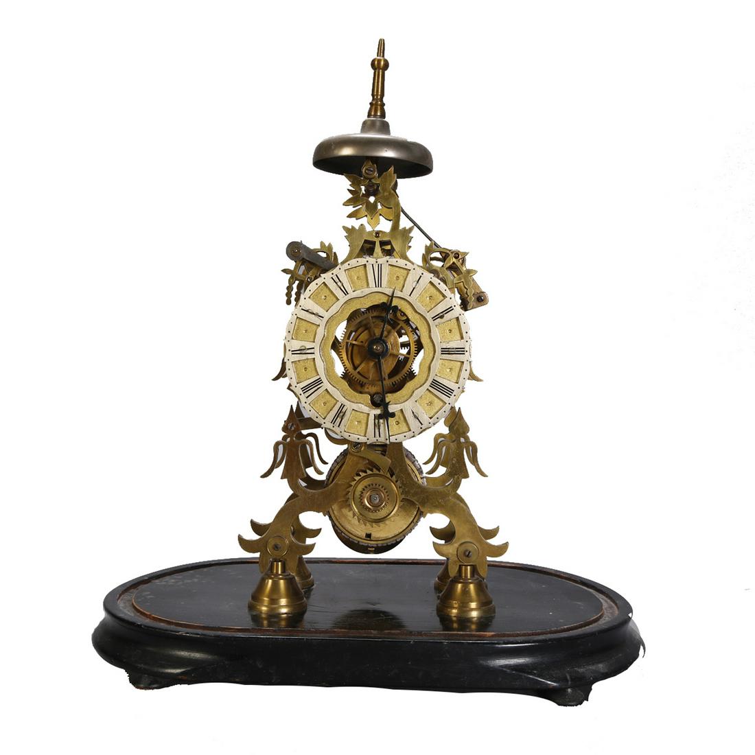 English Skeleton Clock on Ebonized Wood Base: English Brass Skeleton Clock on Wood Base Measures - 16.5" h x 13.5" w x 7.5" d ***IN-HOUSE SHIPPING & DELIVERY QUICK QUOTES AVAILABLE UPON REQUEST***