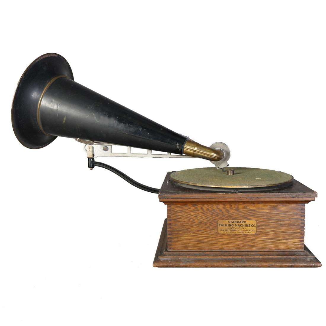 Standard Disk Front Mount Phonograph, c1910: An antique front mount disc phonograph by Standard Talking Machine Co., Chicago offers oak case and ebonized horn, c1910. Measures - 16" h x 25" l, 11.5" 11.5" bs ***IN-HOUSE SHIPPING & DELIVERY QUICK