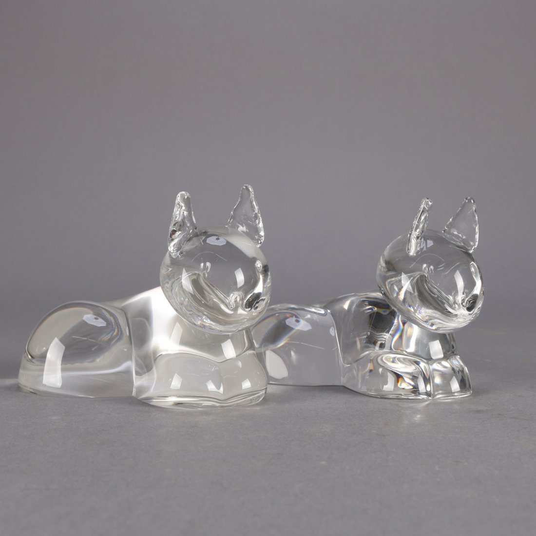Pair Steuben Crystal Figural Cats: A pair of Steuben figural art glass recumbent cats, one signed and one unsigned frosted base, 20th centuryMeasure - 3"h x 4.5"w x 2.75"d ***IN-HOUSE SHIPPING & DELIVERY QUICK QUOTES AVAILABLE UPON REQ