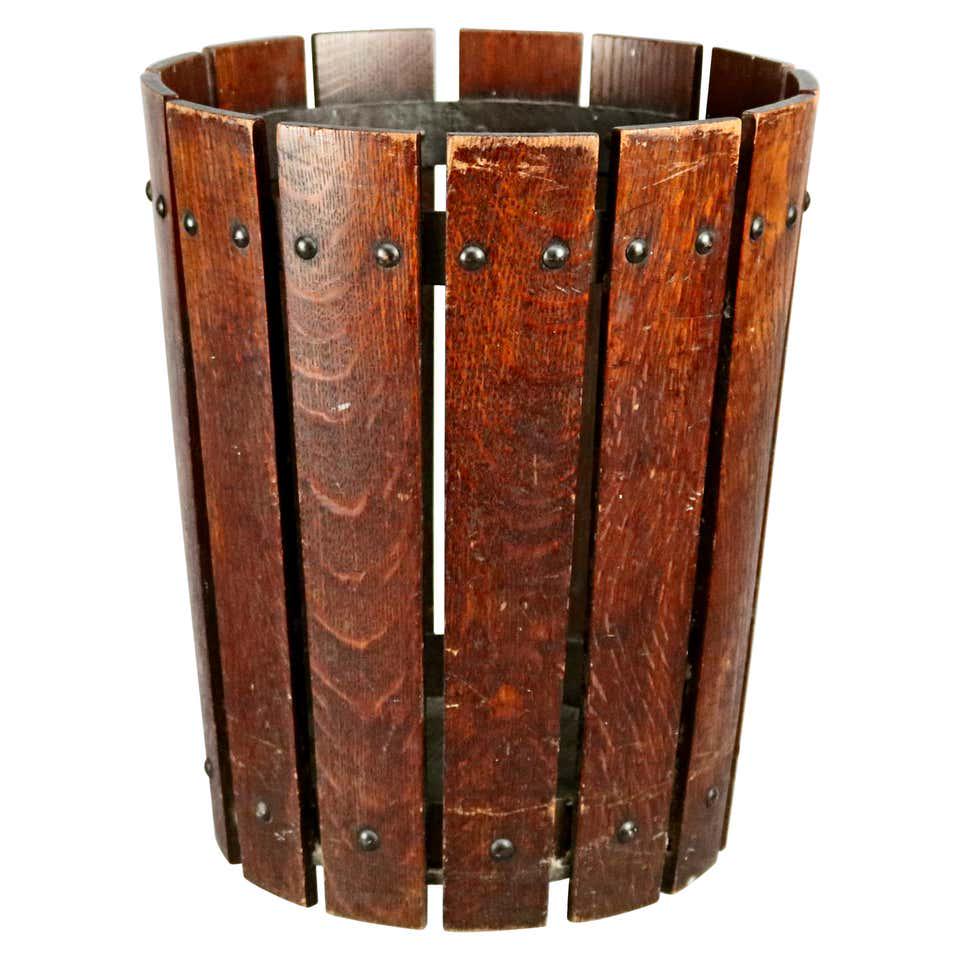 Arts & Crafts Mission Oak Gustav Stickley Slat Basket: An Arts & Crafts waste basket by Gustav Stickley offers quarter sawn oak slat construction in flared form, original label as photographed, circa 1910 Measures: 14" height x 11.75" width x 9.5" diamete