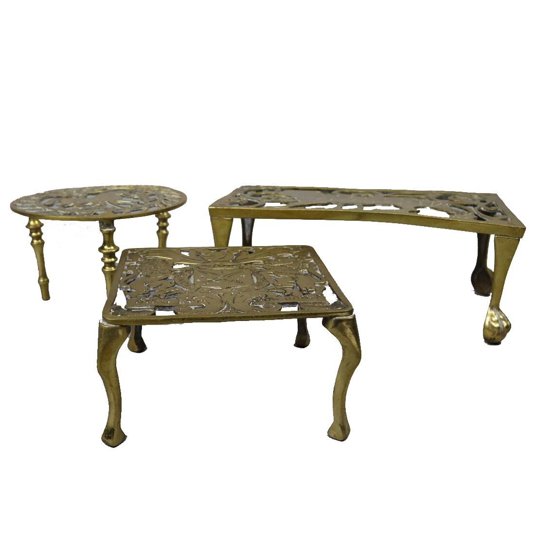 Assorted Lot of 3 Brass Fireplace Trivets: Assorted Lot of 3 Brass Fireplace Trivets. Measures - 4" h x 10.5" w, 3.5" h lowest. ***IN-HOUSE SHIPPING & DELIVERY QUICK QUOTES AVAILABLE UPON REQUEST***