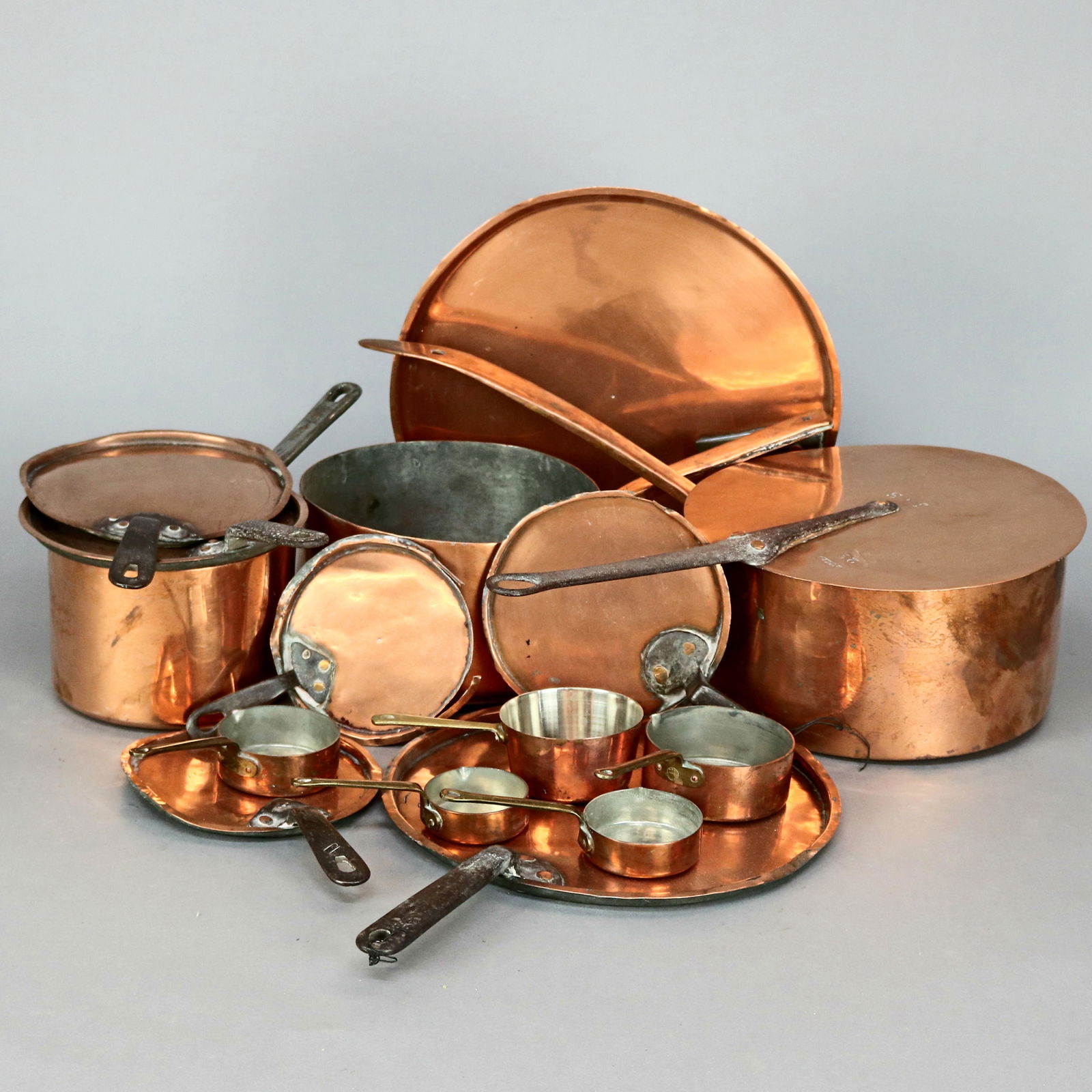Copper Pots & Asstd Lids: 8 Copper Pots and 8 Copper Lids of various sizes. Lids do not match pots. Brass and hand wrought handles.***IN-HOUSE SHIPPING & DELIVERY QUICK QUOTES AVAILABLE UPON REQUEST***