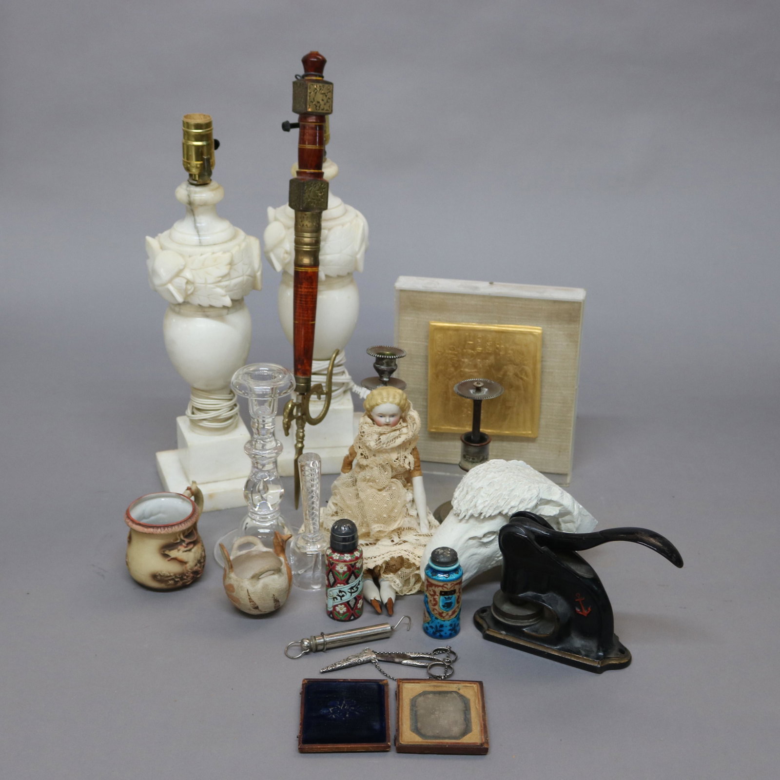 Miscellaneous Lot: Assorted lot to include; Alabaster Lamps, Carved Wood Rams Head, Porcelain Doll, Metal Seal Stamp and others.***IN-HOUSE SHIPPING & DELIVERY QUICK QUOTES AVAILABLE UPON REQUEST***