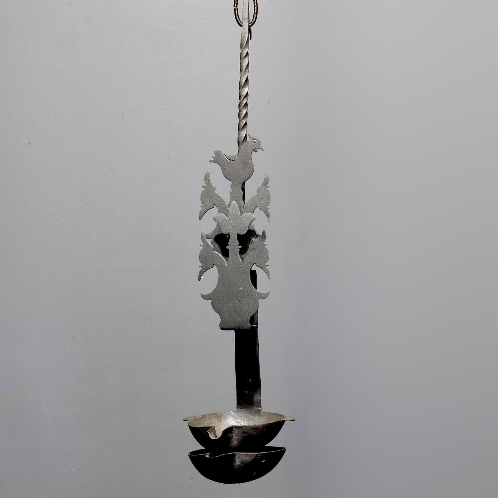 Cut Tin Figural Colonial Revival Wall Oil Lamps, 20th C: Cut Tin Figural Colonial Revival Wall Oil Lamps offer twisted handle and cut out rooster and flowers, 20th C