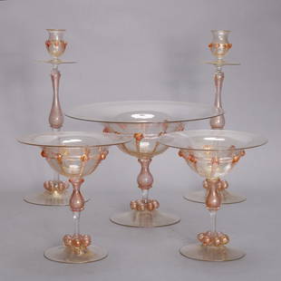 5-Pc Italian Venetian Murano Glass Set: 5-Pc Italian Venetian Murano Glass Set includes compote, pair of stemmed dessert and pair of candlesticks each having pink/peach elements and gold throughout, c1910. Measures - candles 13.5"h x 5"diam