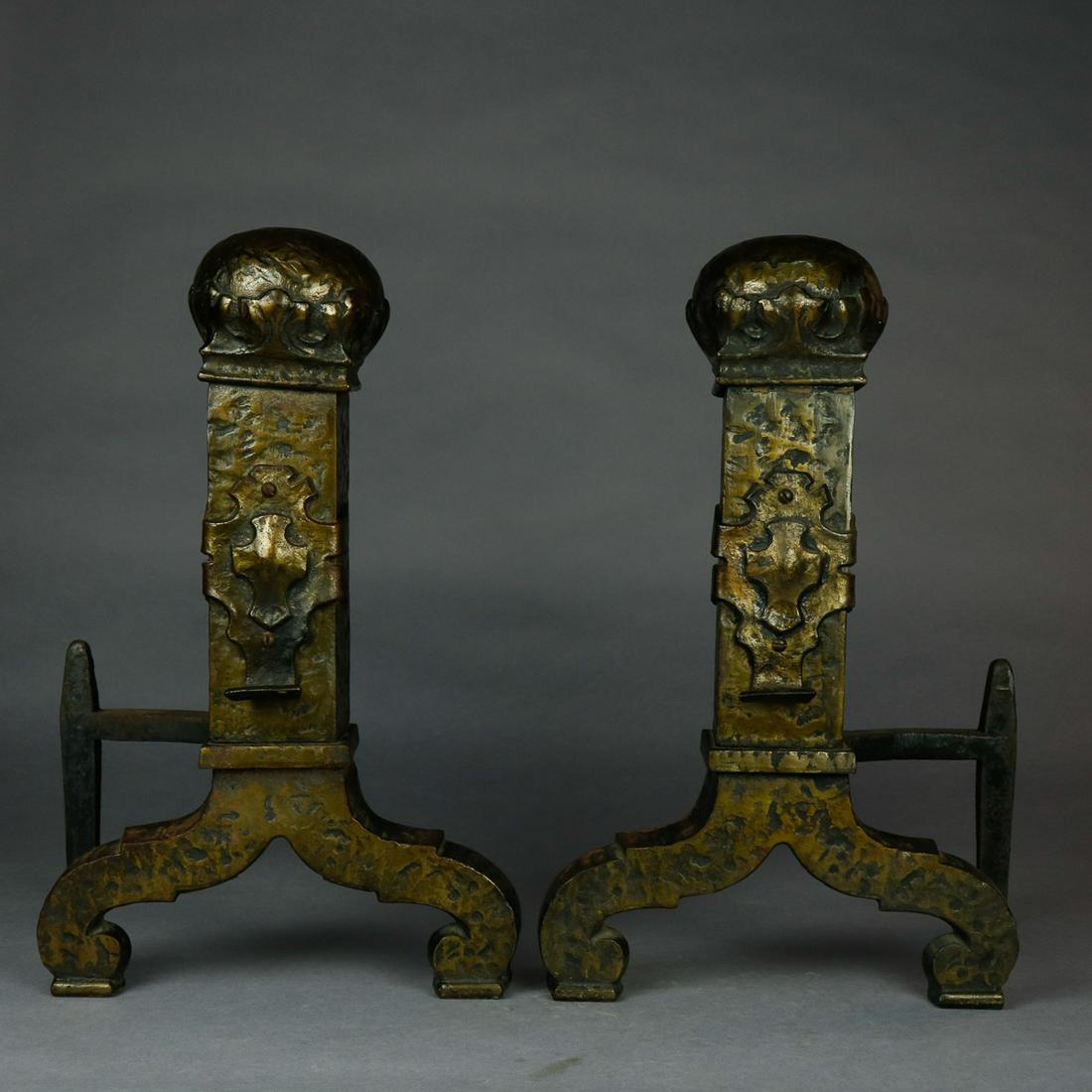Antique Gothic Bradley & Hubbard Style Brass Andirons: A set of antique Gothic Bradley and Hubbard School brass fireplace andirons offer hammered brass in tower form with central shield and oversized ball finial raised on scroll form feet, without firedog