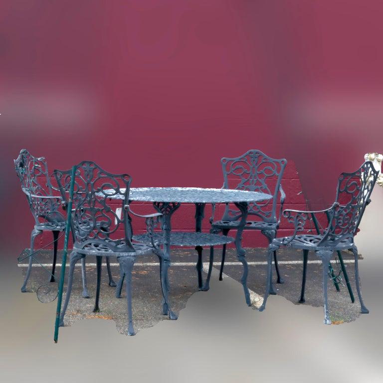 Antique Garden Table and 4 Chairs, 20th C: Antique Garden Table and 4 Chairs, 20th C. Measures- Table- 25.5" H x 41" Dia, Chairs- 34.5" H x 19.75" W. ***IN-HOUSE SHIPPING & DELIVERY QUICK QUOTES AVAILABLE UPON REQUEST*** ***DELIVERY NOTICE - D