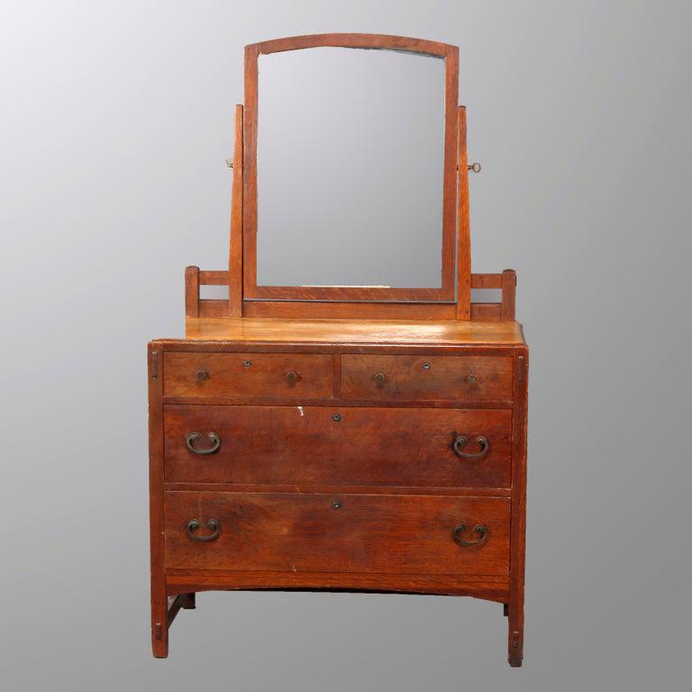 Antique Limbert Arts & Crafts Mission Oak Dresser: An antique Arts and Crafts MIssion Oak chest of drawers by Limbert offers slightly arched mirror surmounting two over two case raised on square and straight legs, without label, guaranteed Libert, c19