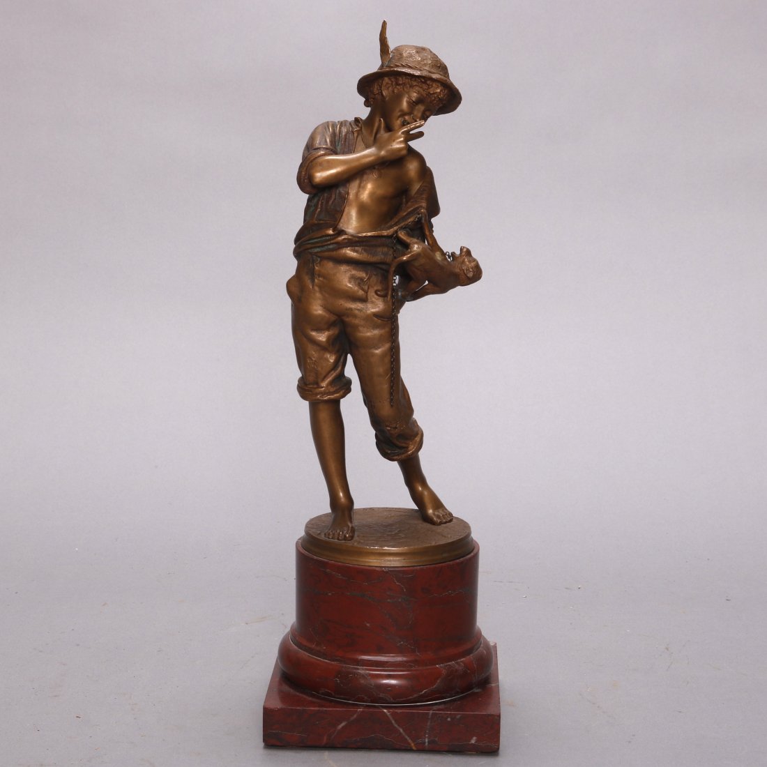 Antique Bronze Statue of Boy with Monkey by CT Wagener: An antique bronze statue by Carl Theodor Wegener (Denmark, 1862-1935) depicts a boy (street urchin) with a cigar and monkey mounted on marble plinth, signed on base as photographed, 19th century. Meas