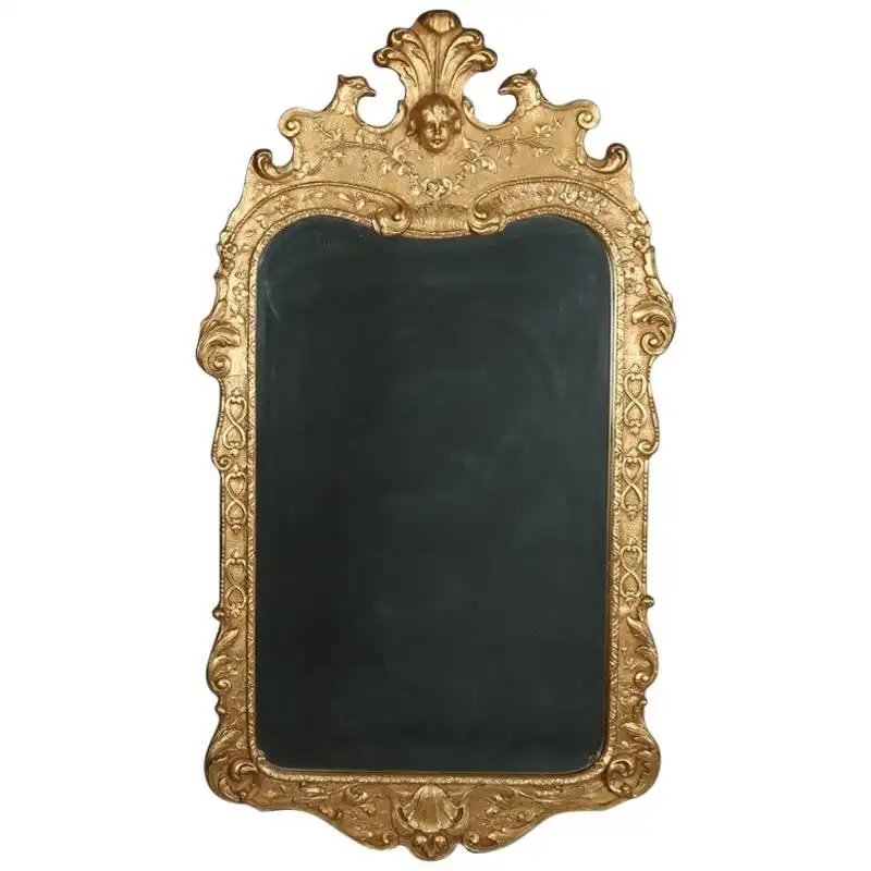 French Louis XIV Style Figural Henredon Natchez Mirror: French Louis XIV style giltwood wall mirror by Henredon of the Historic Natchez collection features foliate, shell and scroll decorated frame and crest with central mask flanked by figural falcons, 20