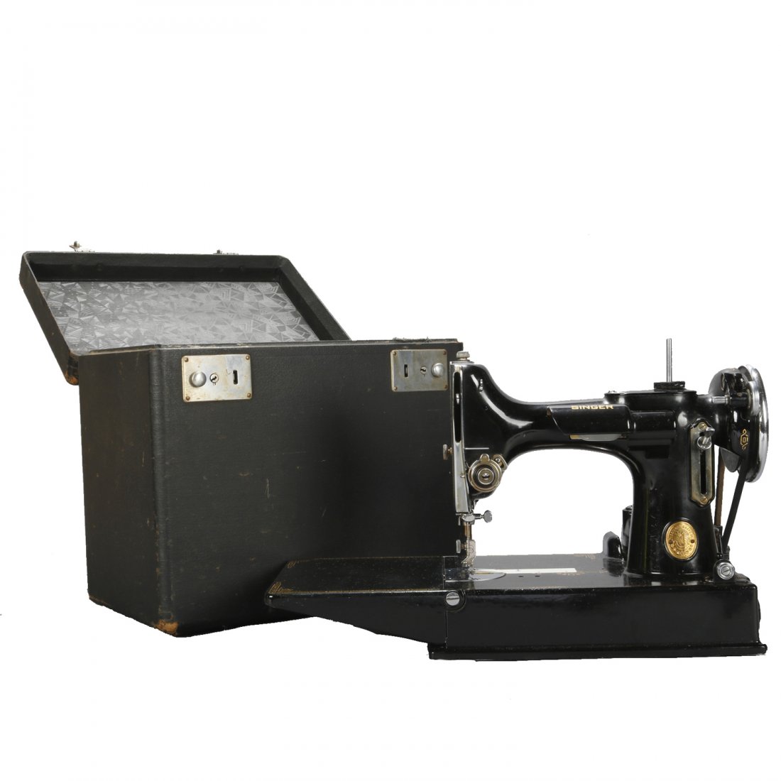 Antique Singer Featherweight Sewing Machine & Case: An antique Singer Featherweight portable sewing machine offers ebonized finish with gilt lettering and decoration, original Singer Manufacturing Co. label as photographed, serial number AE294859, with