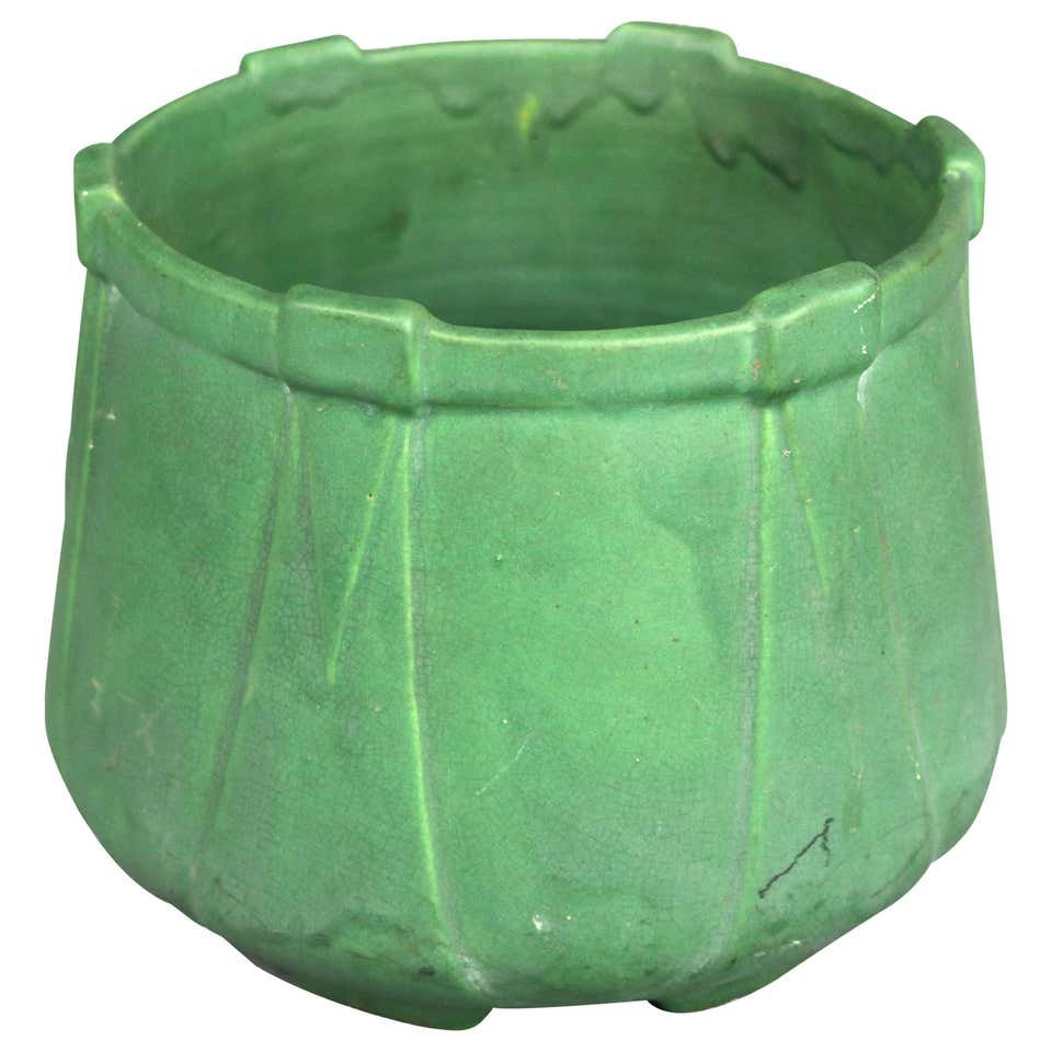 Arts & Crafts Green Teco School Pottery Jardinière: Antique Arts & Crafts jardinière in the manner of Teco offers art pottery construction in footed tech style form having matte green glaze, circa 1910. Measures: 7.25" H x 9.25" Dia. ***IN-HOUSE SHIPP