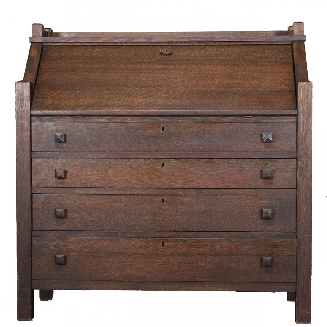 Grand Rapids Mission Oak Arts & Crafts Drop Front Desk: An antique Arts & Crafts Mission secretary by Cron-Kills Co., Piqua, OH offers oak construction paneled sides with slant drop front desk surmounting four long drawers and raised on straight and square