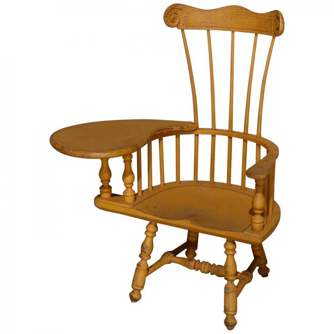 Child's Yellow Painted Writing Arm Windsor Chair, 20th: Child's writing arm Windsor chair offers yellow painted tall back chair with scroll crest surmounting spindle back and arms, one with writing desk, 20th century. Measures: 32" H x 25.75" W x 13.5" D.